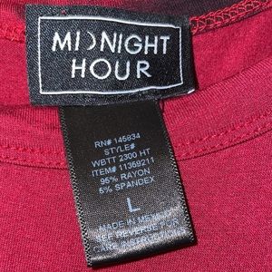 Red casual top with a black sparkly skull